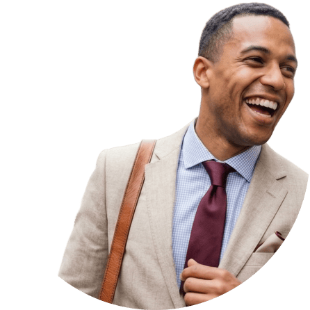 Laughing man in suit crossing the street